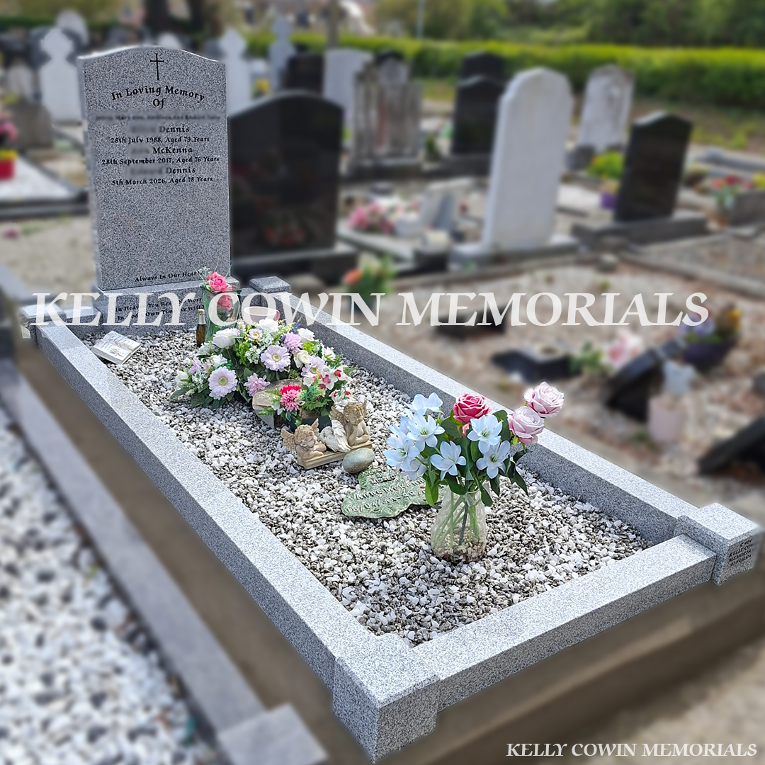 Side view of grey granite memorial with kerbing and chippings