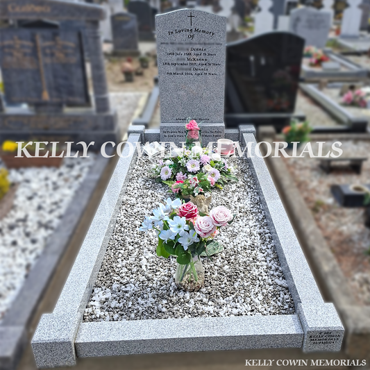 Front view of grey granite OG headstone with black inscription in Balbriggan cemetery