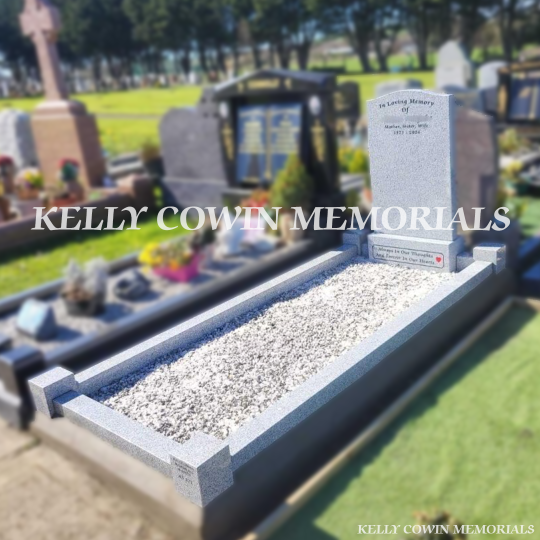 Front view of grey granite OG headstone with black inscription in Newcastle Cemetery