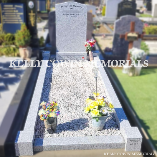 Front view of grey granite OG headstone with black inscription in Newcastle Cemetery