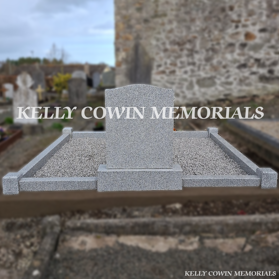 Rear view of grey granite memorial with kerbing and corner posts