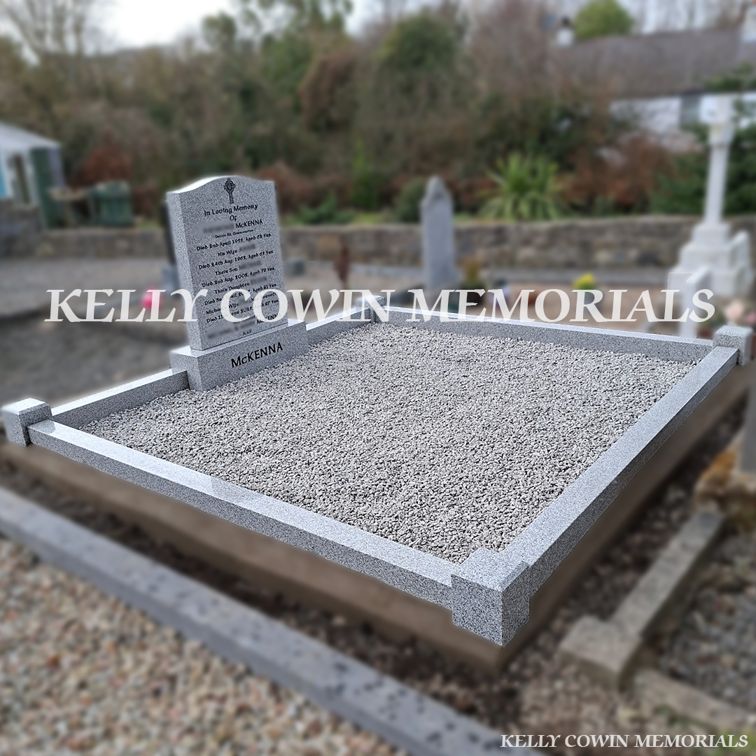 Side view of grey granite memorial with kerbing and corner posts