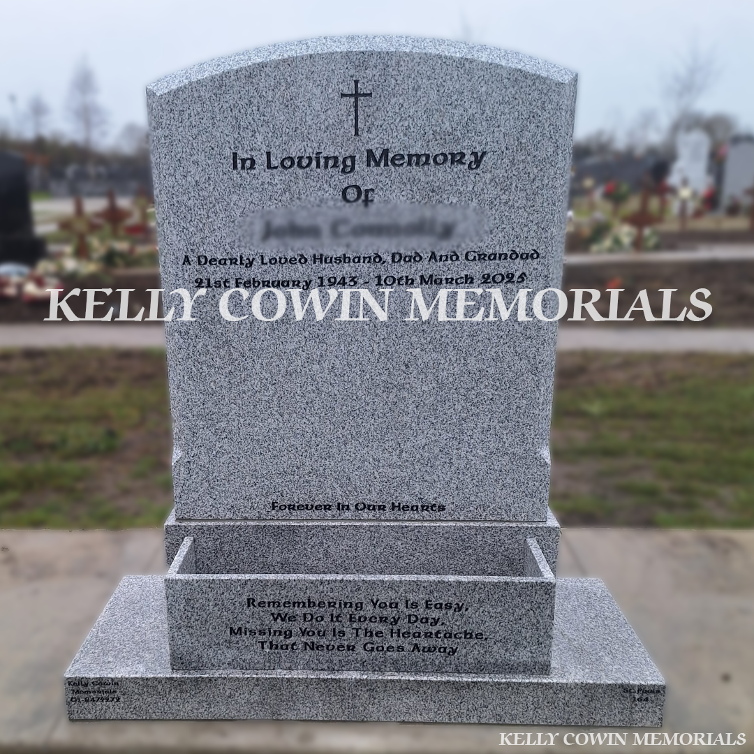 Front view of Grey Granite polished boulder headstone with flower box on base and plinth in Balgriffin Cemetery Dublin