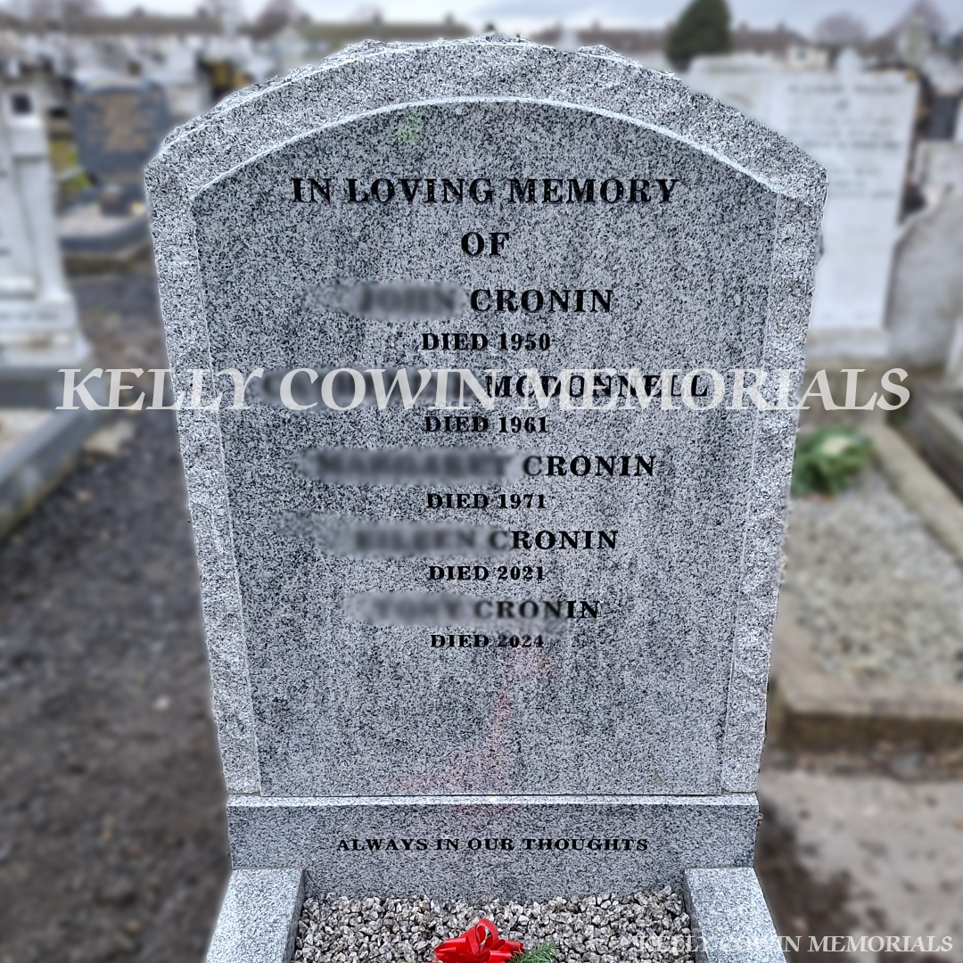 Grey granite rough edge boulder headstone erected in Mount Jerome Cemetery Dublin by Kelly Cowin Memorials