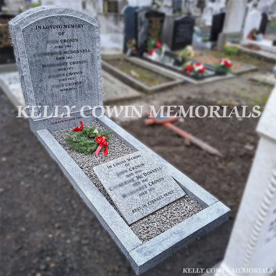 Side view of grey granite boulder headstone with kerbing in Mount Jerome Cemetery Dublin