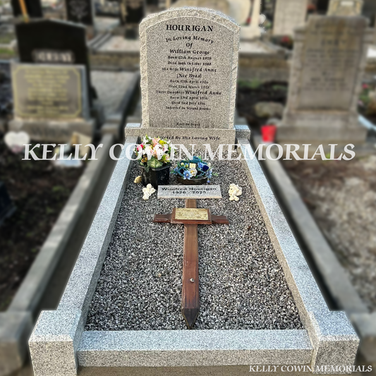 Front view of grey granite rough edge boulder headstone with kerbing and chippings in Fingal Cemetery Dublin by Kelly Cowin Memorials
