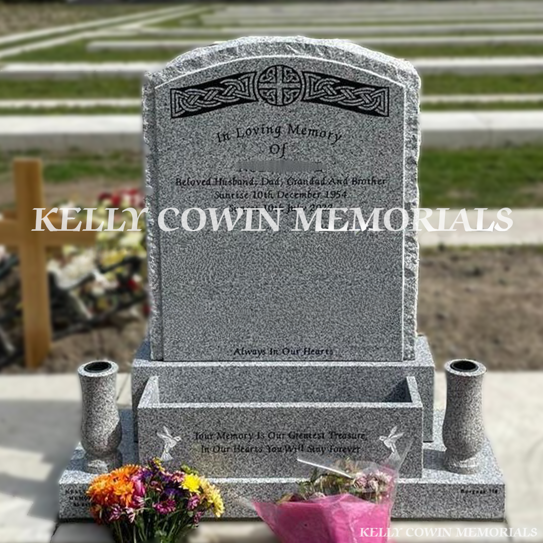Front view:
Front view of Grey Granite rough edge boulder headstone with granite vases erected in Balgriffin Cemetery Dublin by Kelly Cowin Memorials