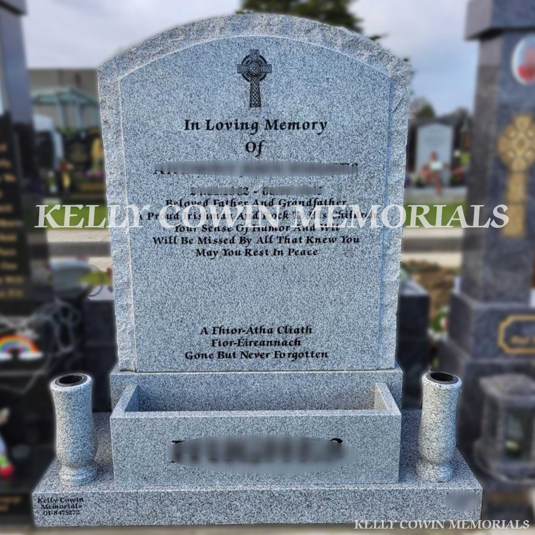 Grey granite rough edge boulder headstone erected in Balgriffin Cemetery Dublin by Kelly Cowin Memorials