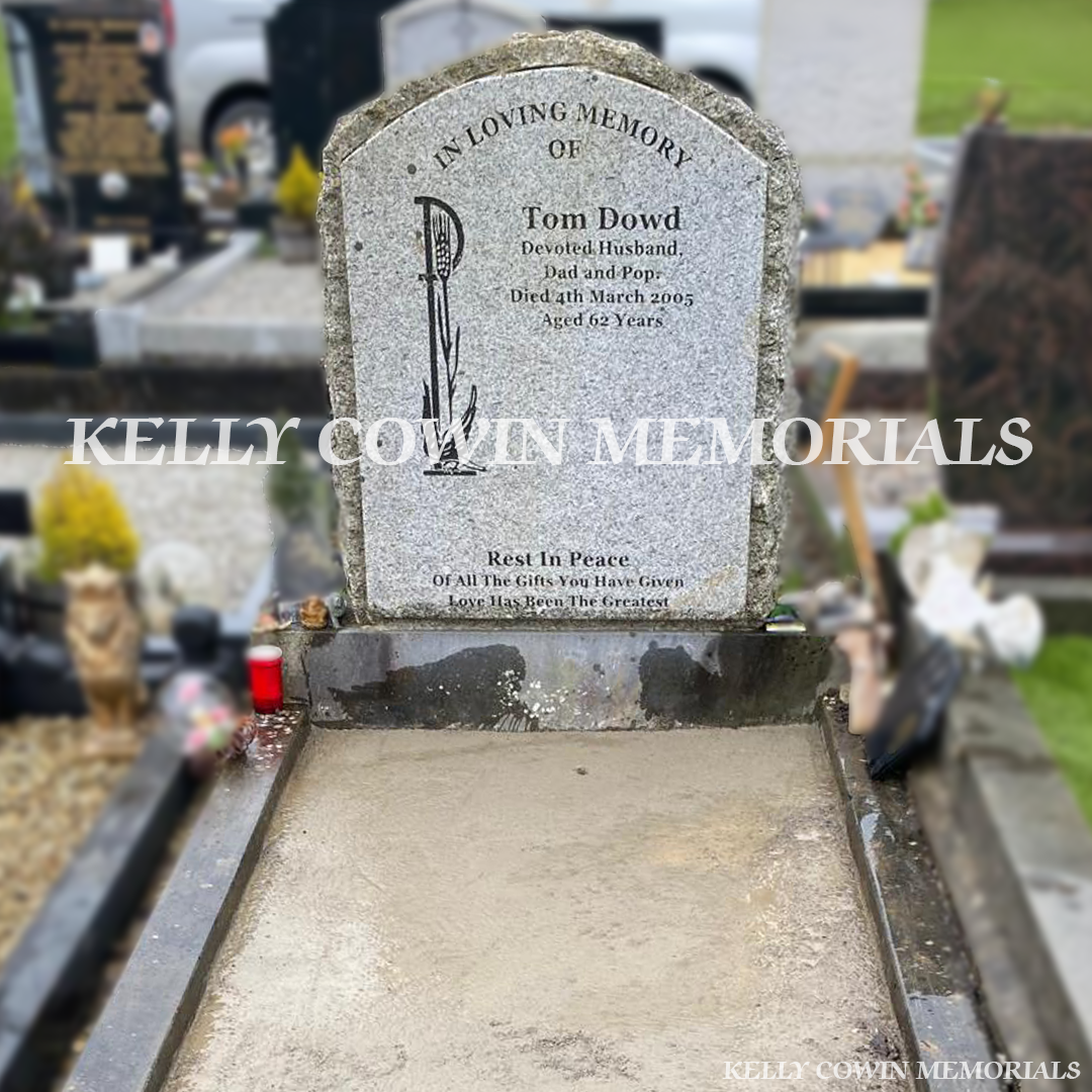 Before renovation of grey granite boulder memorial in Newcastle Cemetery