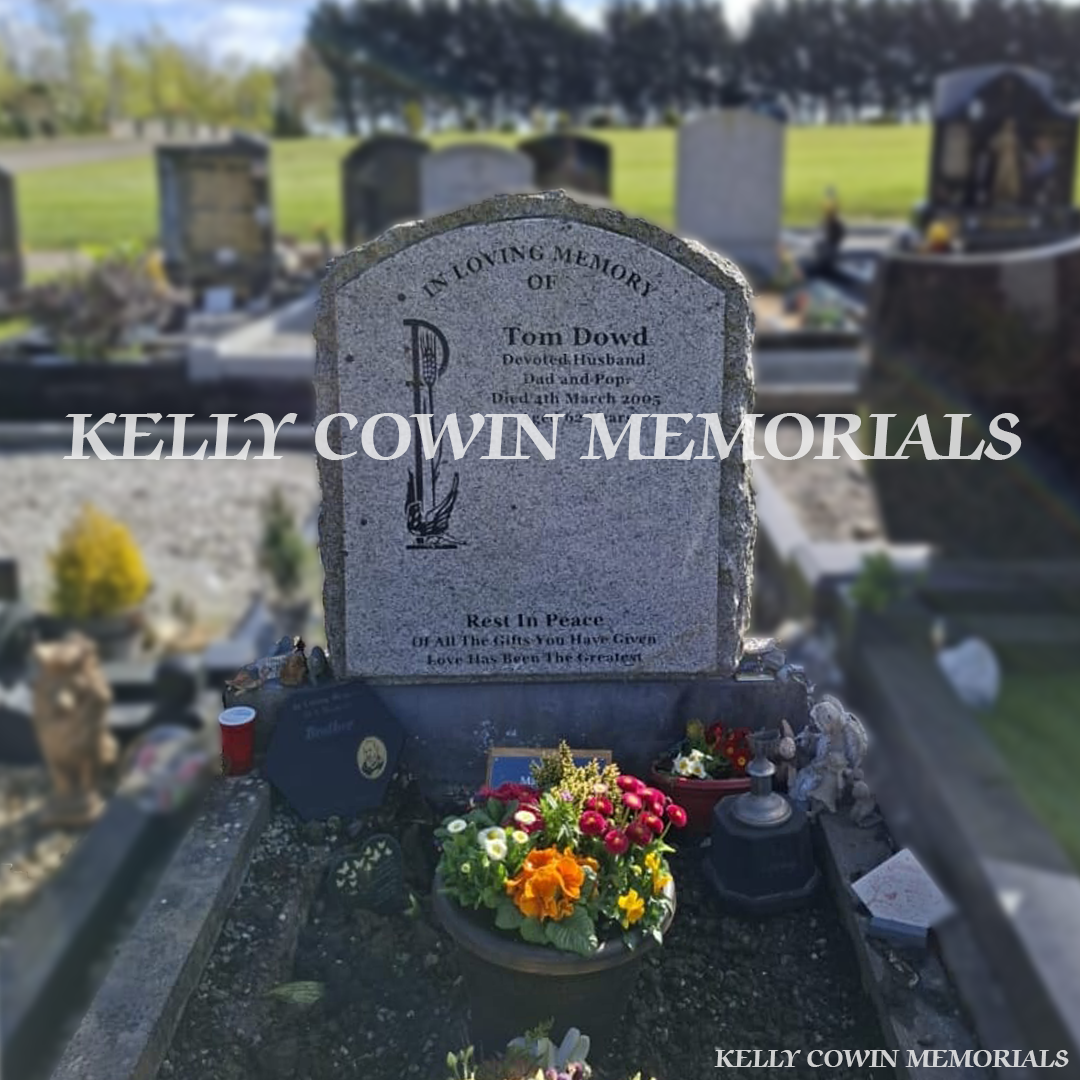 Before renovation of grey granite boulder memorial in Newcastle Cemetery