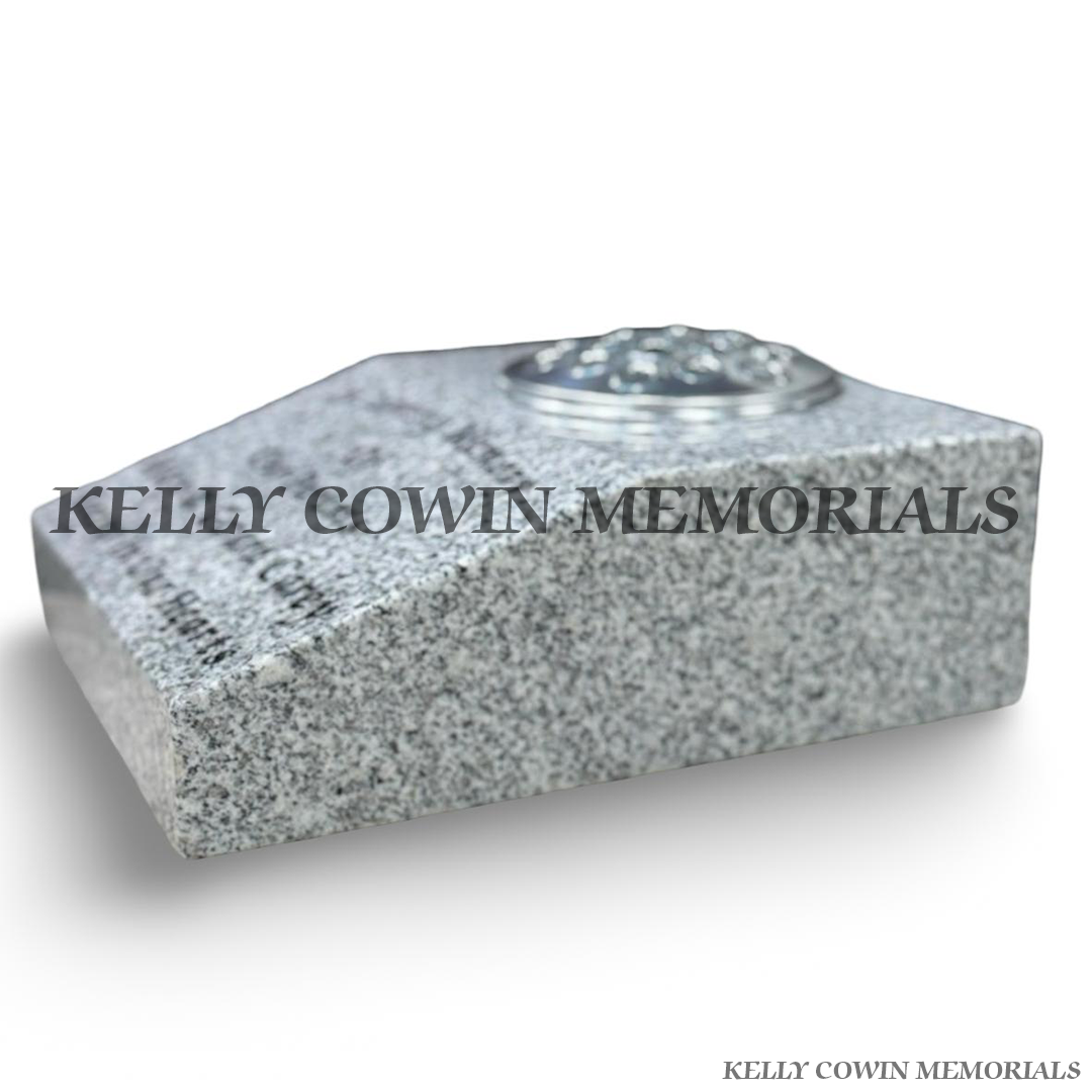 side view Grey granite sloped memorial grave vase with silver flower holder lid and personalised black engraved inscription.