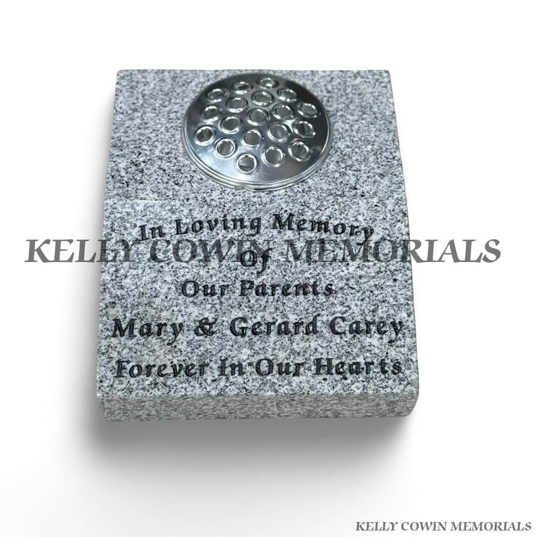 Grey granite sloped memorial grave vase with silver flower holder lid and personalised black engraved inscription.