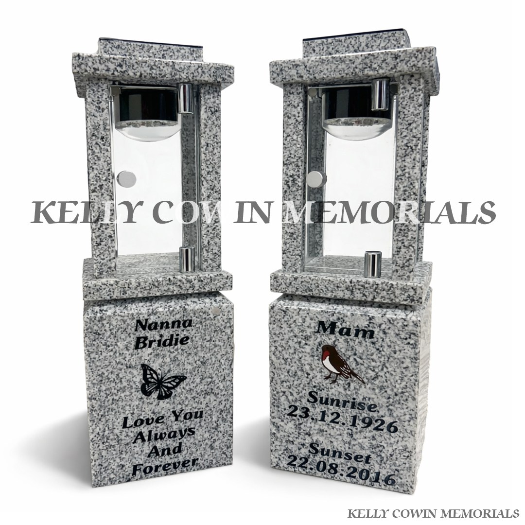 Front view of grey granite solar lantern pair with black engraving and robin and butterfly images