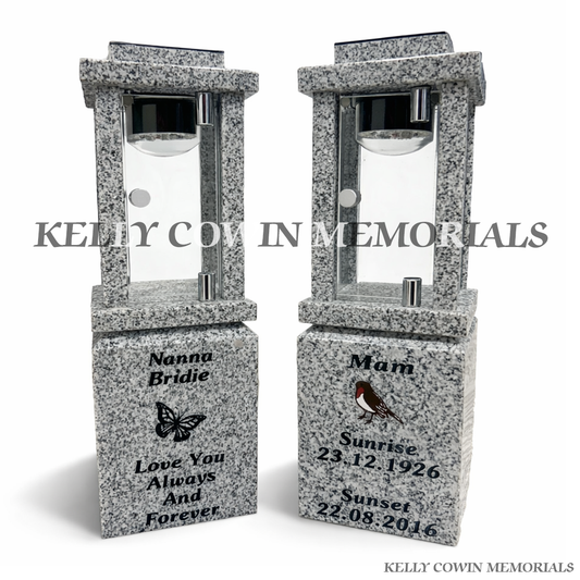 Front view of grey granite solar lantern pair with black engraving and robin and butterfly images