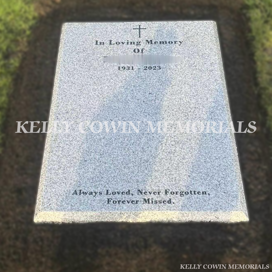 Grey granite St Fintan’s style headstone with black inscription in St Fintan’s Cemetery Sutton