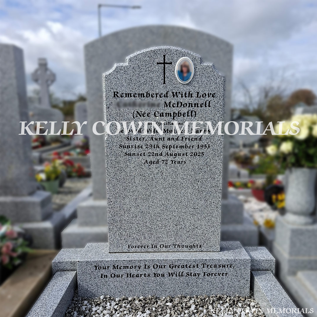 Front close up view of grey granite Top Nine headstone with black inscription in Balrothery Cemetery