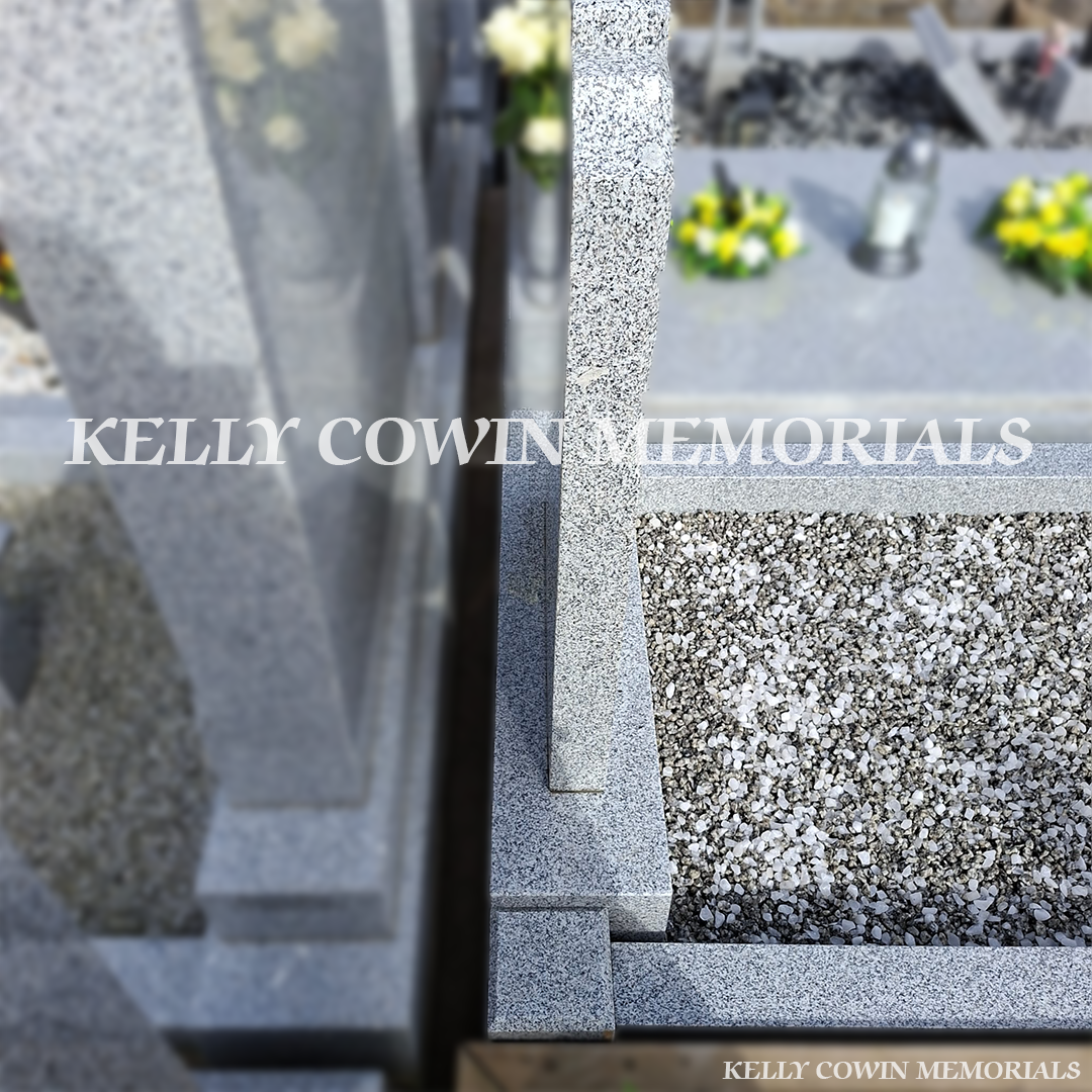 Front view of grey granite Top Nine headstone with black inscription in Balrothery Cemetery