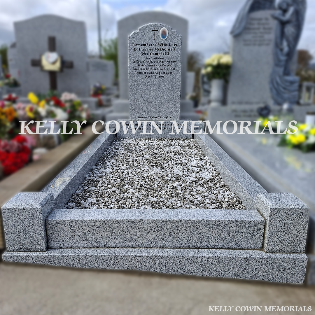 Front view of grey granite Top Nine headstone with black inscription in Balrothery Cemetery