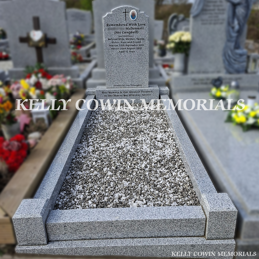 Front view of grey granite Top Nine headstone with black inscription in Balrothery Cemetery
