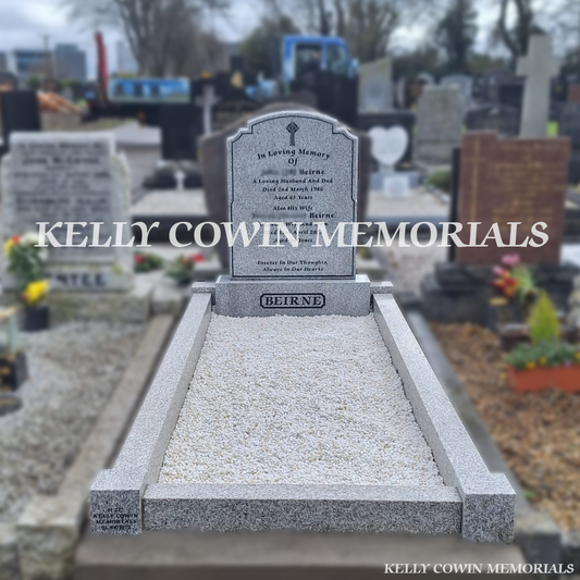 Front view of grey granite Top Nine headstone with black inscription in Mulhuddart Cemetery