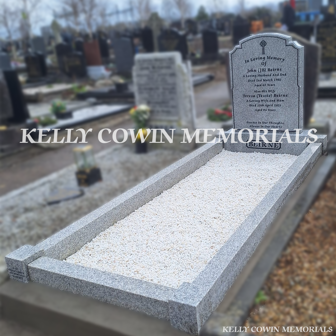 Second side view of grey granite memorial with kerbing and white Moldovan chippings