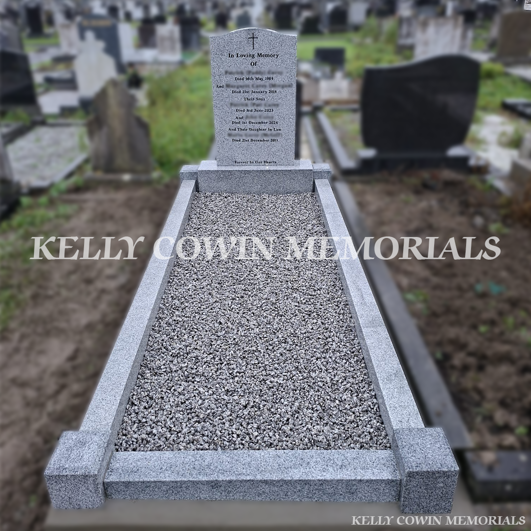 Grey granite headstone with full kerb set and decorative chippings installed by Kelly Cowin Memorials in Balgriffin Cemetery, County Dublin.