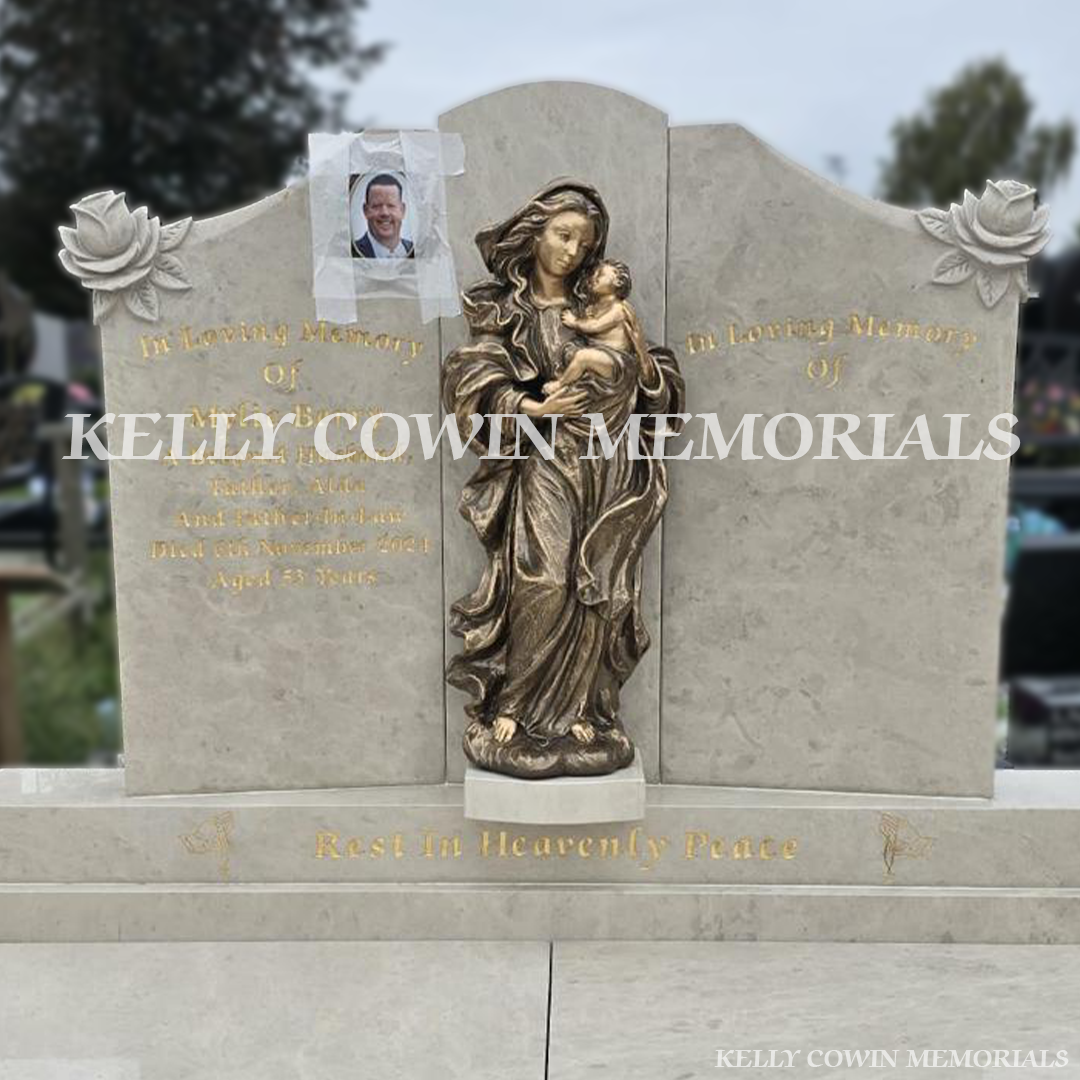 Hand carved rose detail on Haley Beige Cream granite headstone in Carlow Cemetery