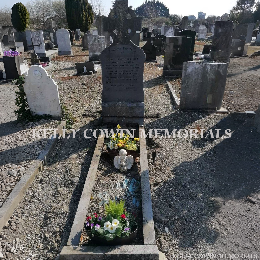 Before  Celtic cross headstone renovation in Dublin showing restored grave with new kerbing, fresh chippings and cleaned memorial by Kelly Cowin Memorials, serving local and nationwide clients.