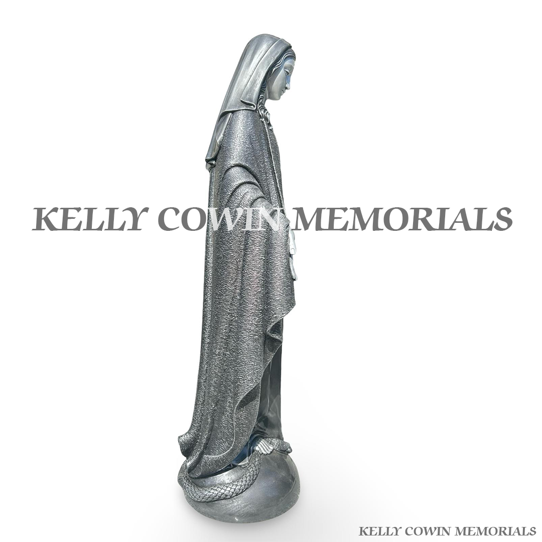 Side view of silver Our Lady religious memorial statue