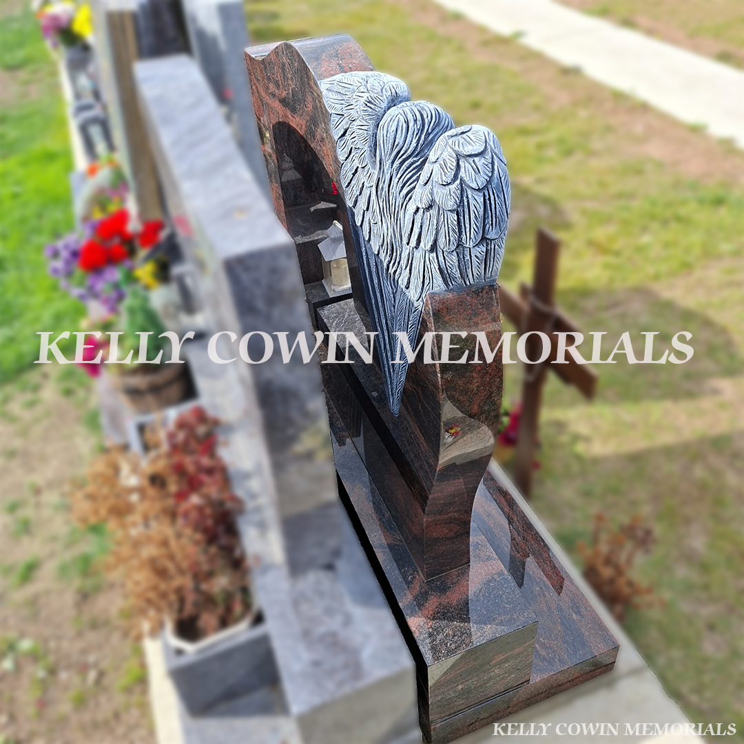 Side view of Pandora granite memorial showcasing the detailed antique carved angel sculpture and polished granite finish in Balgriffin Cemetery, Dublin