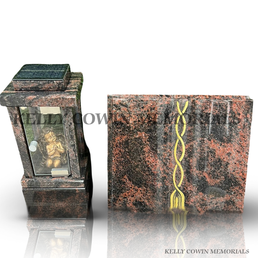 Pandora granite memorial book plaque with gold ribbon detail and matching cherub grave lantern.