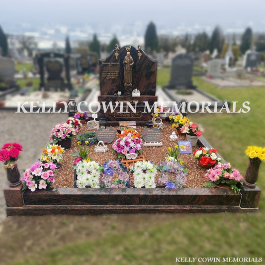 Front view of Pandora granite Gates of Heaven headstone with gold inscription in a Dublin cemetery