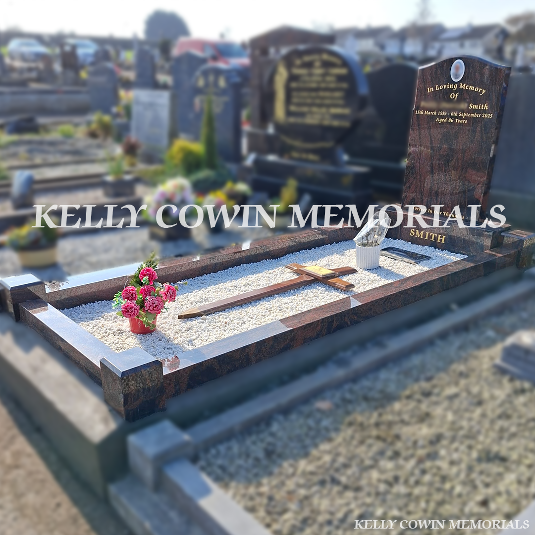 Side view of Pandora granite memorial with kerbing and white chippings