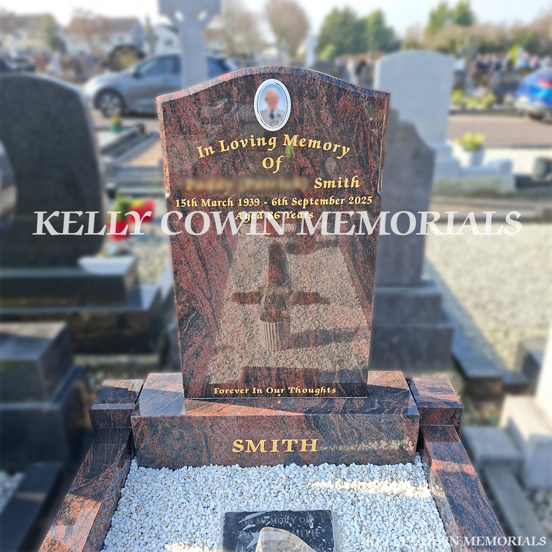 Close-up of 23.5ct gold leaf lettering on Pandora granite headstone