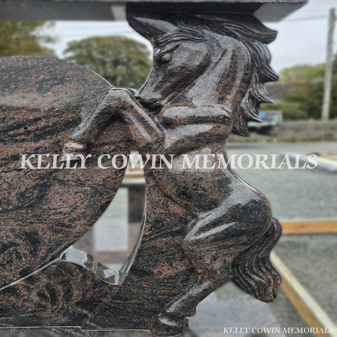 Close-up of carved granite horse on Pandora granite heart headstone showing detailed craftsmanship — Kelly Cowin Memorials.