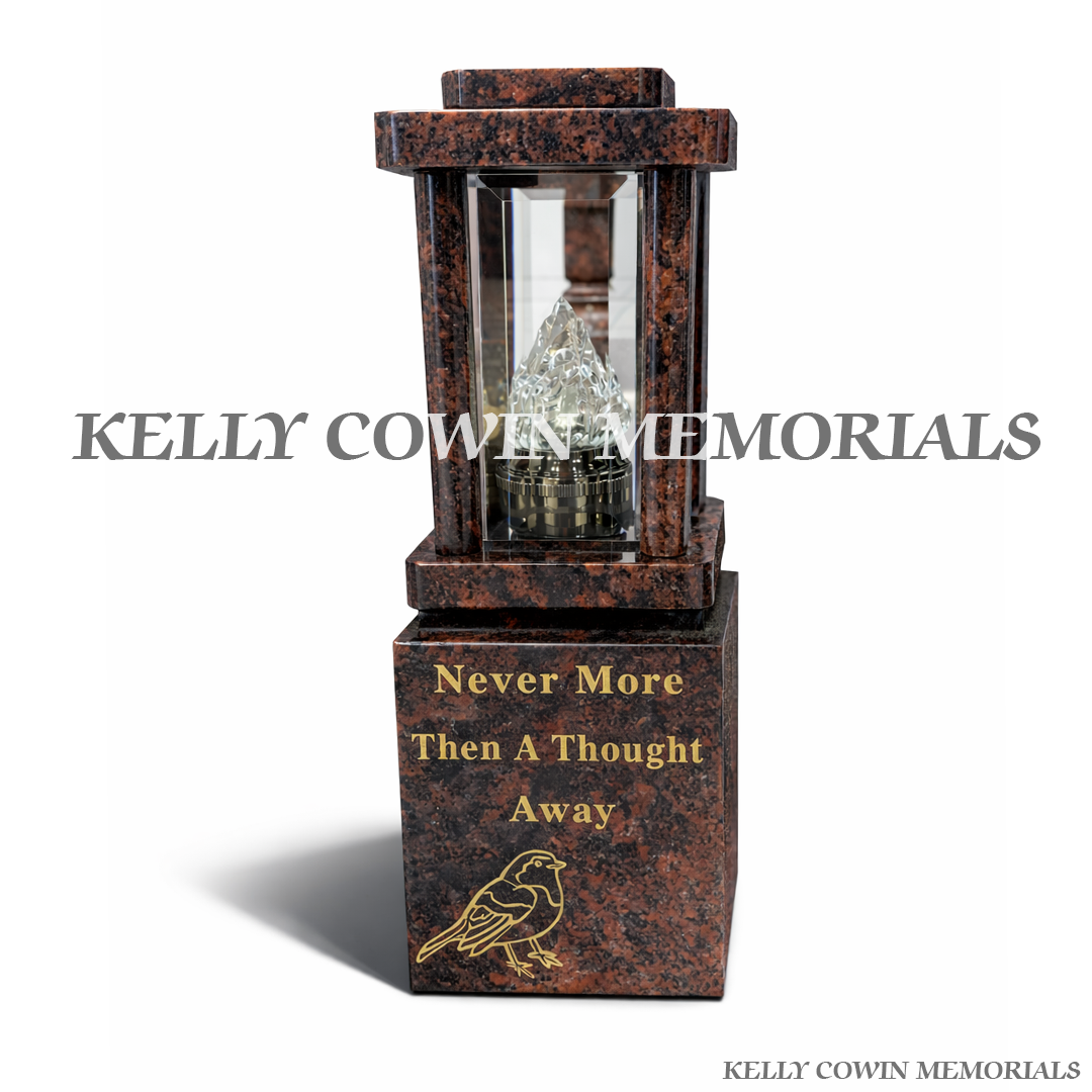 Front view of two Pandora granite lanterns with gold robin engraving