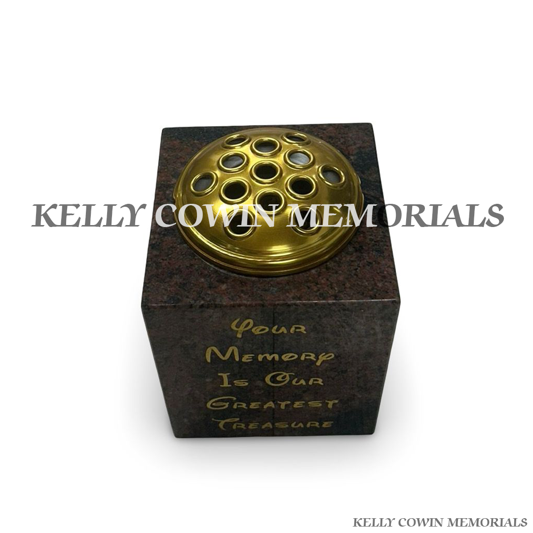 Side view of polished Pandora granite square vase with gold lid