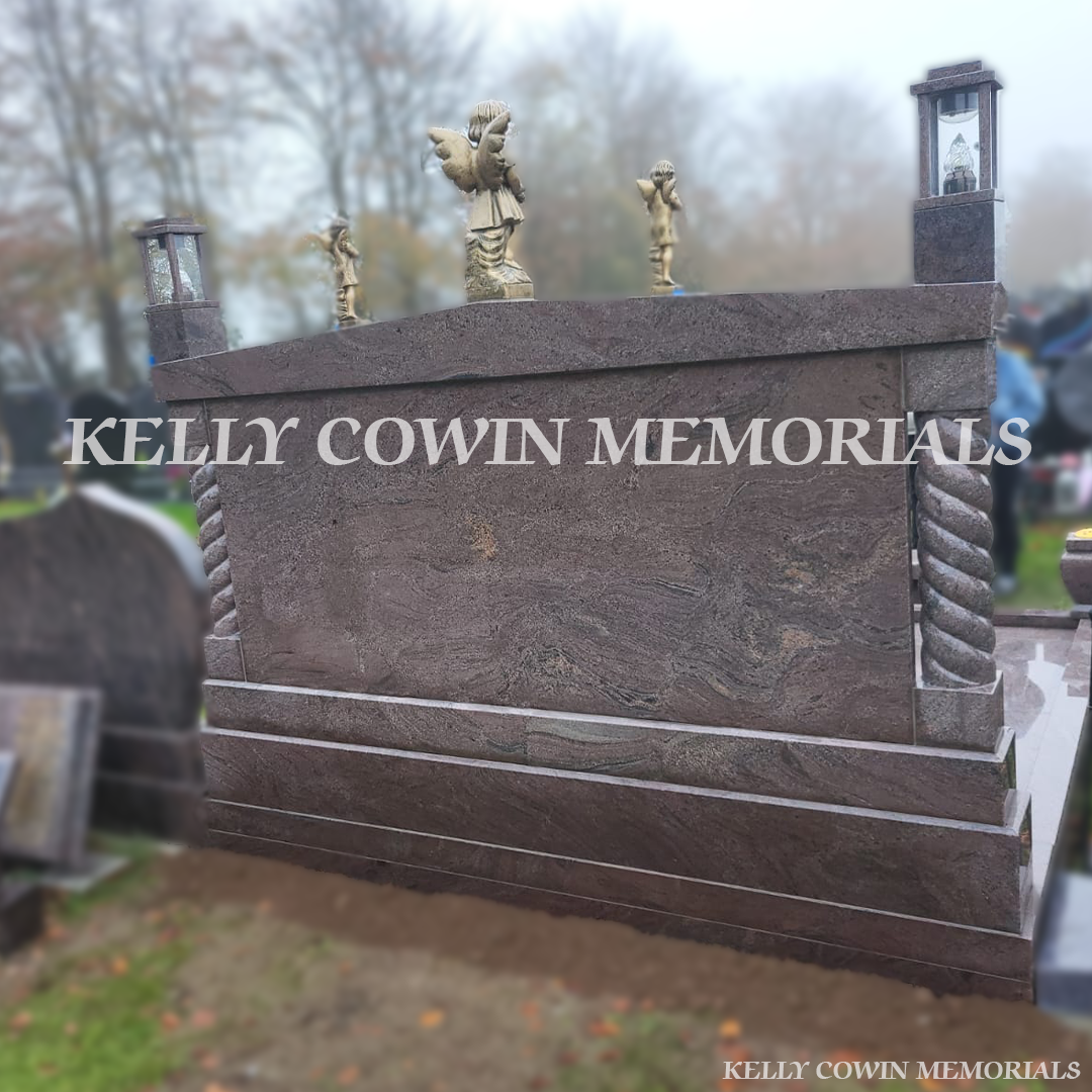 Paradiso granite double book Traveller headstone with statues, gold leaf inscription and heart plaques in Mount St Oliver Cemetery, Limerick