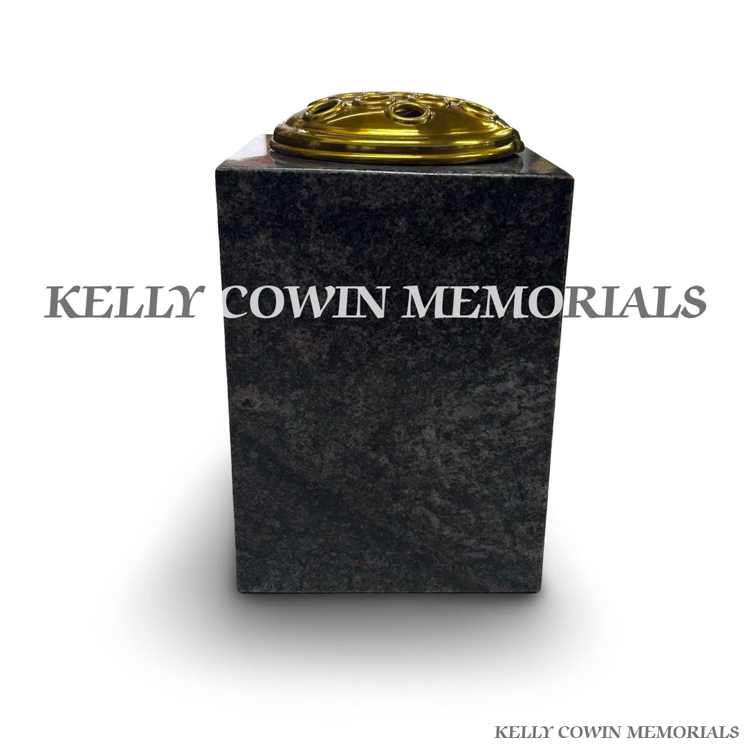 back view of polished Paradiso granite square vase with gold lid