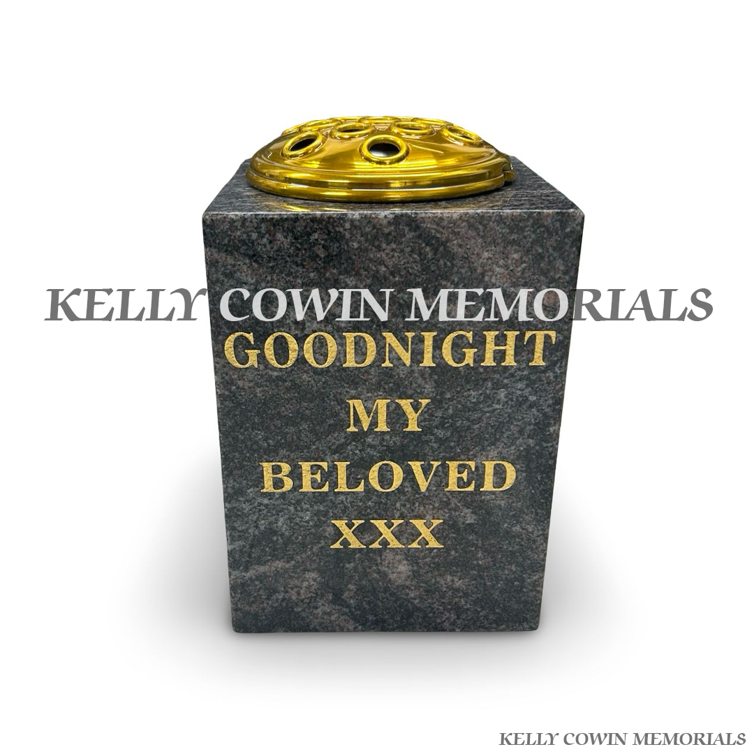 Front view of Paradiso granite square vase with gold lid and gold inscription