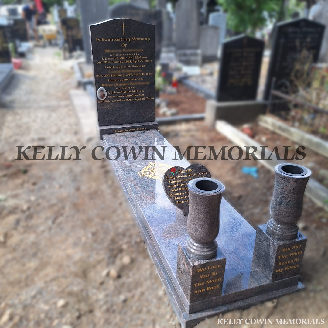side view of a Paradiso OG granite headstone with full kerbing, covering slab, two large vases on blocks, 12-inch heart, ceramic photo and gold inscription in Glasnevin Cemetery Dublin by Kelly Cowin Memorials.