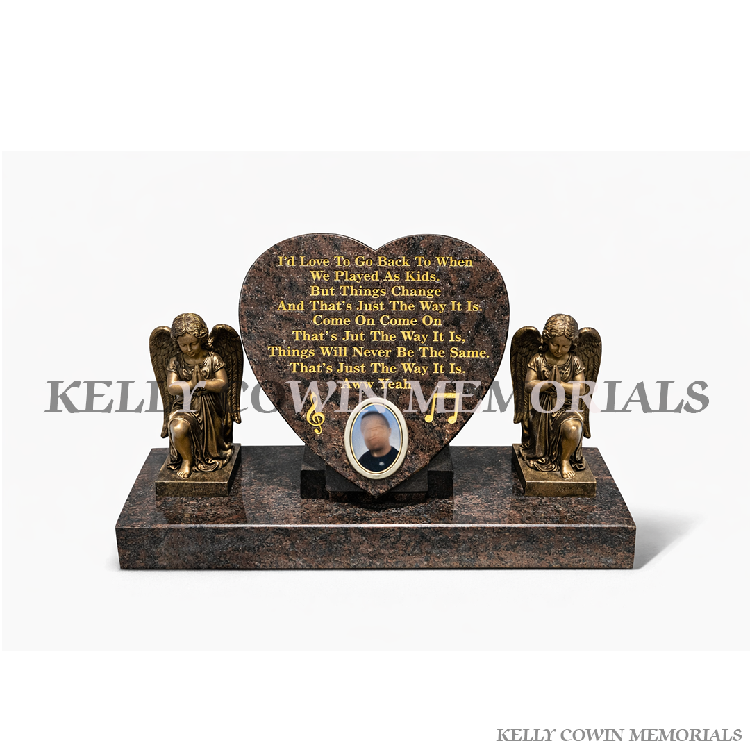 12 inch granite heart memorial with statues on plinth, made in Ireland. Weather-resistant tribute. Local service with nationwide delivery.