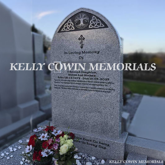 Side view showing full grey granite kerbing, corner posts and garden bar in Balrothery Cemetery