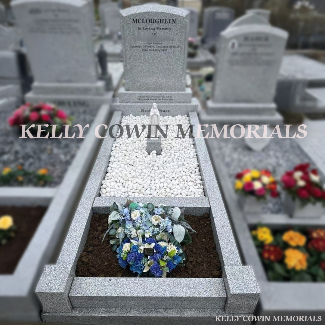 Grey granite polished boulder memorial with tassel detailing, polished chippings and garden kerbing by Kelly Cowin Memorials Ireland
