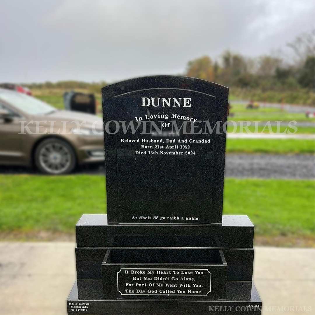 Rustenburg Granite polished boulder headstone with flowerbox and silver inscription installed in Dardistown Cemetery by Kelly Cowin Memorials