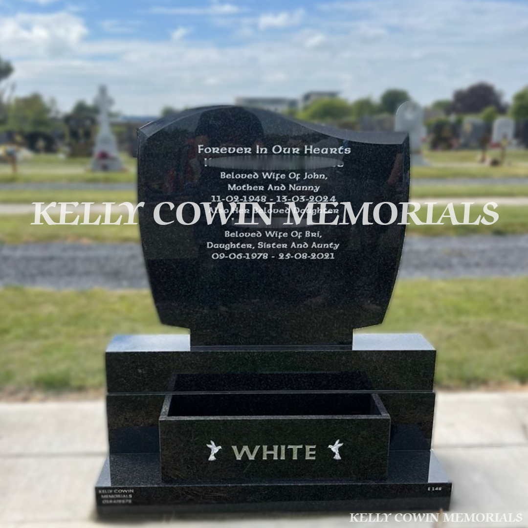 Front view of Rustenburg C1 headstone with silver inscription and flower box in Dardistown Cemetery Dublin