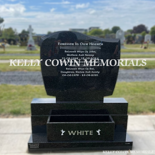 Front view of Rustenburg C1 headstone with silver inscription and flower box in Dardistown Cemetery Dublin