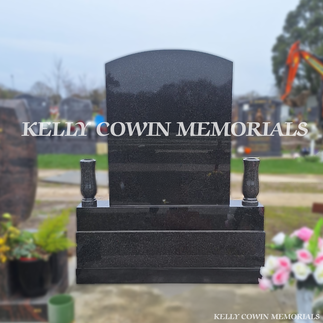 Side view showing lanterns, flower box and vases on Rustenburg granite memorial