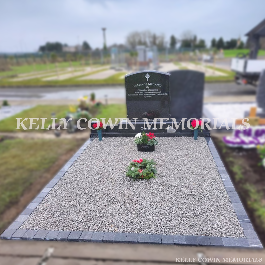 “Rustenburg polished boulder headstone with limestone cobbles and grey granite chippings installed in St Declan’s Cemetery Ashbourne by Kelly Cowin Memorials”