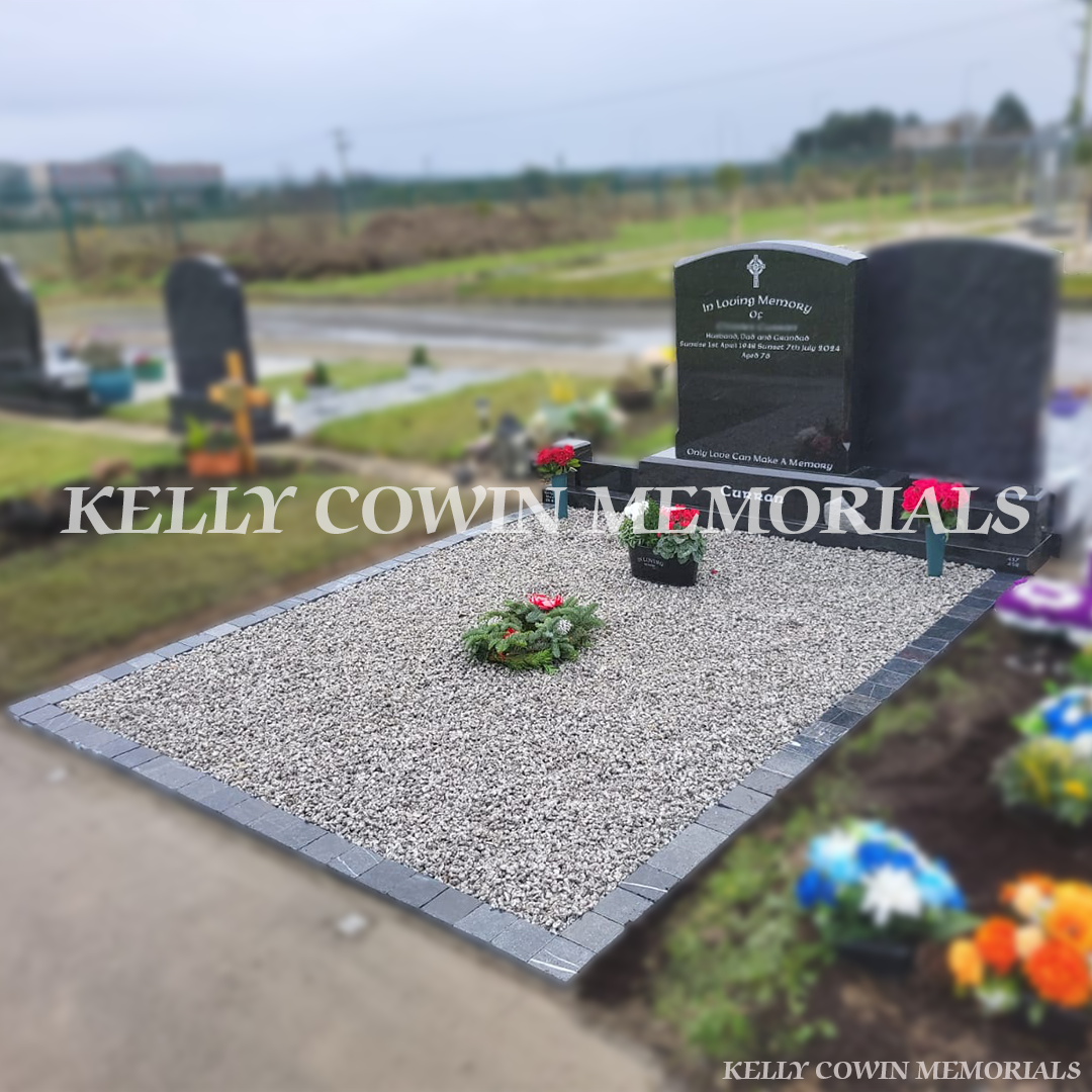 Side view of Rustenburg granite boulder headstone on 8ft plinth with corner posts in St Declan’s Cemetery Ashbourne